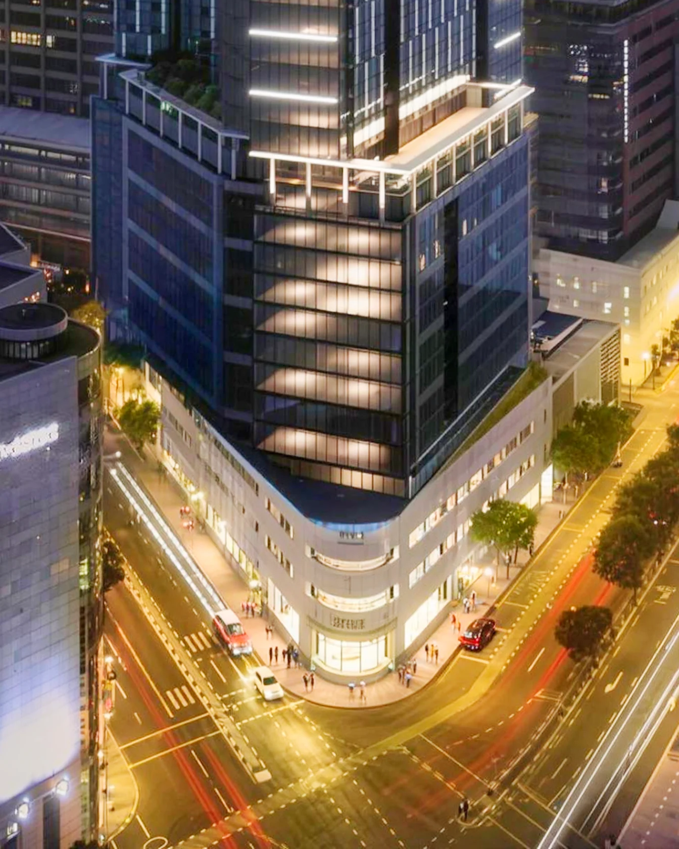 The glass tower rising from the heritage corner building, from the developer's render